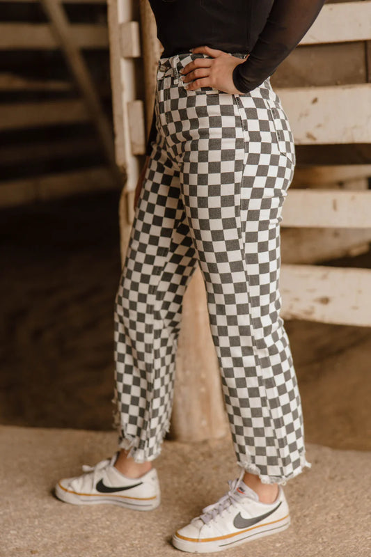 Fast Lane Pants by Sterling Kreek black and white checkered high rise distressed hem stretch jeans
Optional extra alt text versions:
Model wearing black and white checkered Fast Lane Pants by Sterling Kreek
Checkered high rise jeans with distressed raw hem detail
Sterling Kreek Fast Lane Pants statement denim boutique jeans