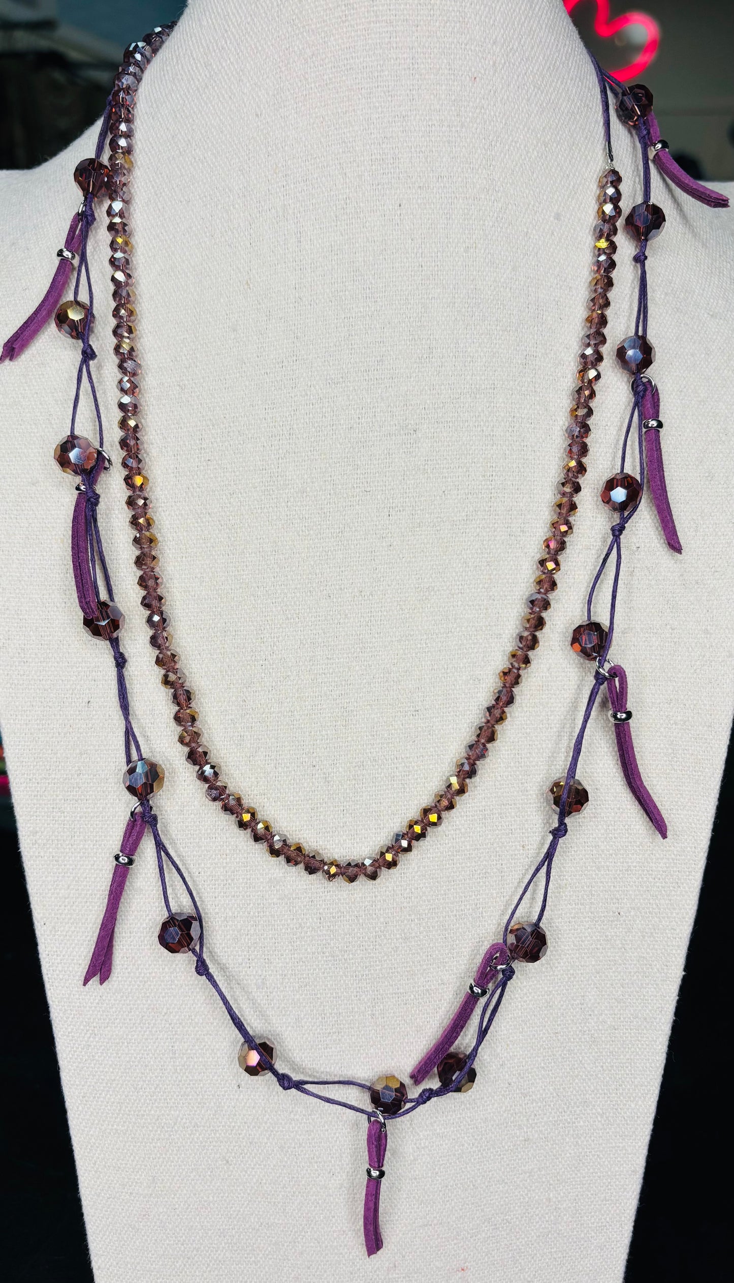 Beaded Necklace with leather on one side. Opposite side is stretchy. Great for layering,