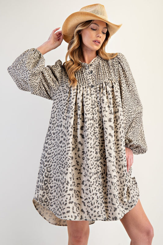 Snow Leopard Print dress with an oversixed fit. This dress features pockets at the side and buttons going down the front and can easily be worn as a cardigan or duster with a cute graphic tee or tank under. Design by Easel