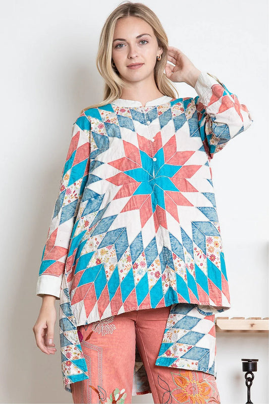 Top is by Blue Velvet and we are in love. This is an oversized fit and everyone should size down. There is no stretch in the material, but it very comfortable. High-low Top in a start quilt design with POCKETS at the sides. This is truly Wearable Art.