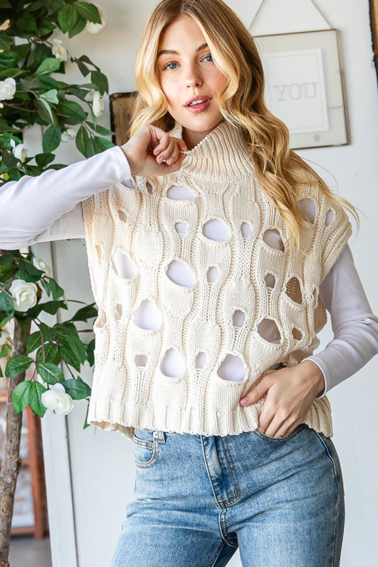 Oli and Hali have done it again with this lovely knit vest with intentional holes as an added statement piece. Wear this back with your favorite Blazer or dernim jacket for the perfect ayering piece or by iteself with a cute mesh under for some extra charm.
Brand: Oli and Hali