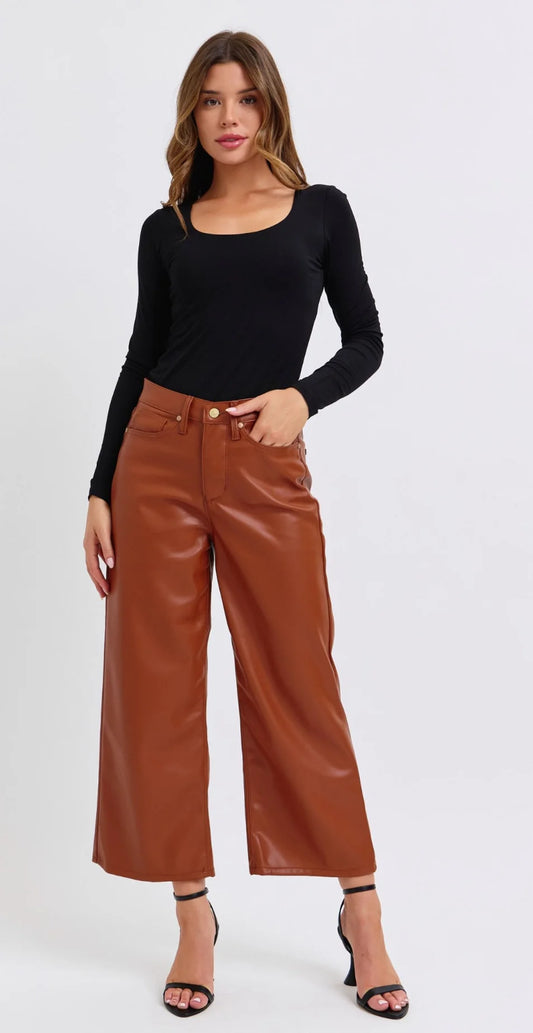 Cropped Faux Leather Pants by Judy Blue. These pants are lined and super comfortable. Unlike other brands they do not make a weird sound when you walk or stick to your skin. They are, however, incredibly comfortable and classy in style.Dress these up or keep them casual with a fun T-Shirt or Sweatshirt.
Brand: Judy Blue