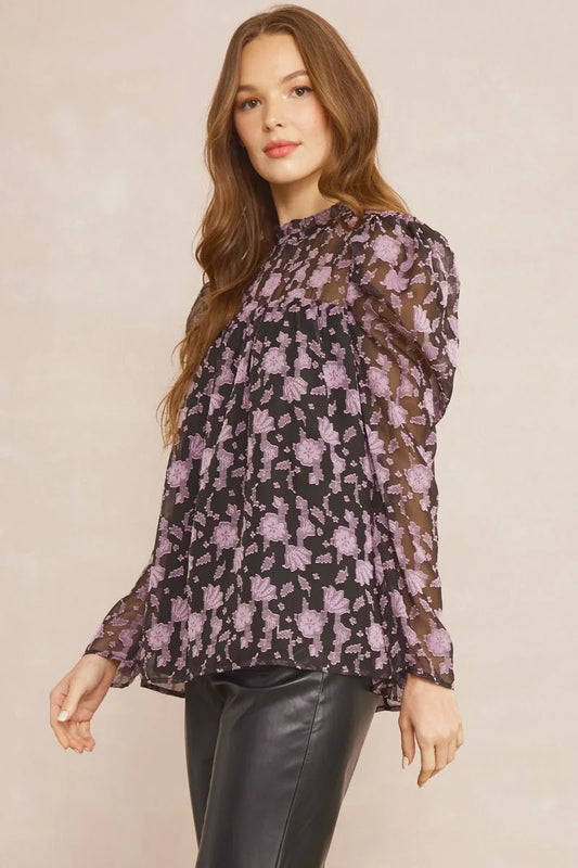 Sheer Black Blouse with lavendar embroidered floral design throughout. This is a beautiful blouse to add to your wardrobe.