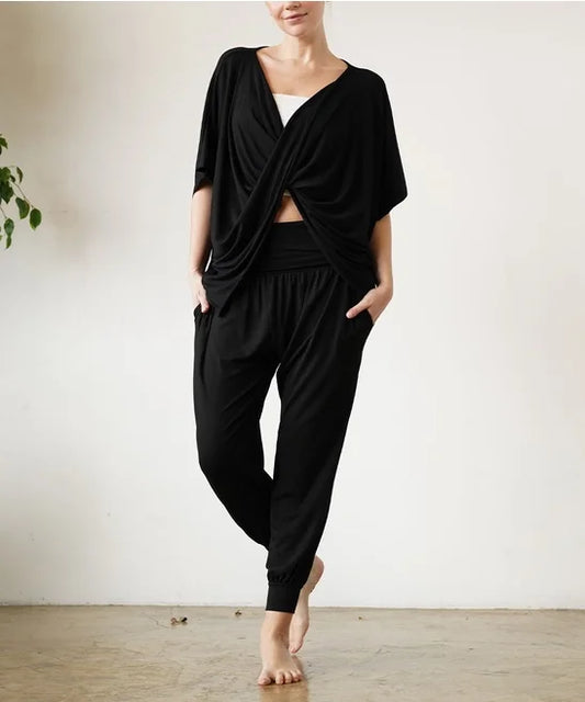 This set is made with  a Bamboo material and is the most siftertest and feels luxurious againt your skin. Tapered, jogger style, pants with an elastic waist band paired back with a Twisted front top. Both are amazing and you are going to want this in your wardrobe. Perfect Yoga Piece or for everyday comfort.
BRAND: STUDIO KO