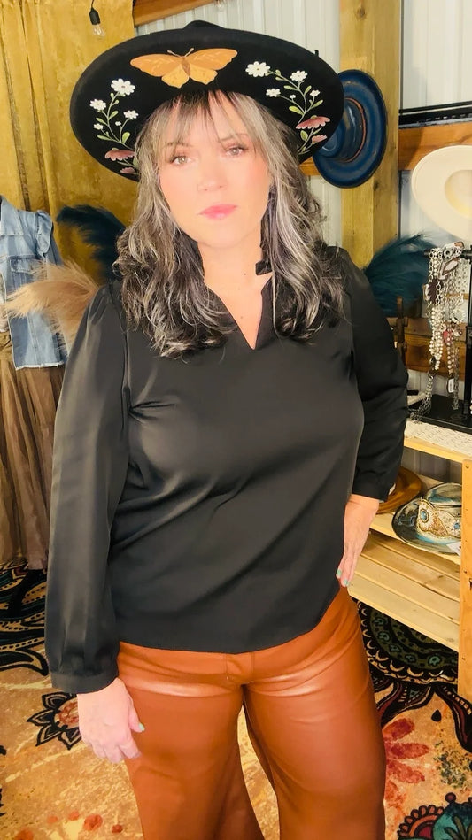 We are loving this Black Blouse by Entro. Perfect to dress up or down. Looks great as an underlayer or by itself to stand out.