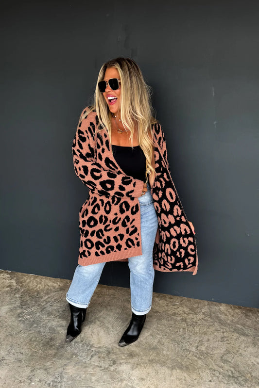 Reversible Leopard Print Cardigan and OMGoodness the SOFTEST sweater you will ever own. Just imagine your most favorite blanket wrapped around you; that is what you get in this Cardigan. Comes in OS (One Size up to size 15) and OSP (Plus Size one Size sizes 14w-24)