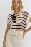 Knit, Short Sleeve, Top wth an adjustbale zipper in the front to wear closed or as a v-neck style.
Made by Entro