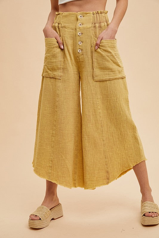 Lightweight, Cotton-Linen blend, wide-leg cropped pants with a raw edge hem. Fun, large pockets. elastic at the waist and button closure for easy  on and off wear.