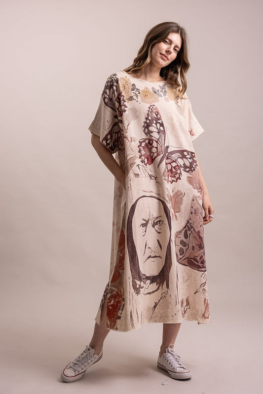 Oversized cream cotton maxi dress by Blue Velvet featuring artistic portrait artwork, butterfly illustrations, earthy floral accents, raw edge details and a relaxed bohemian silhouette.