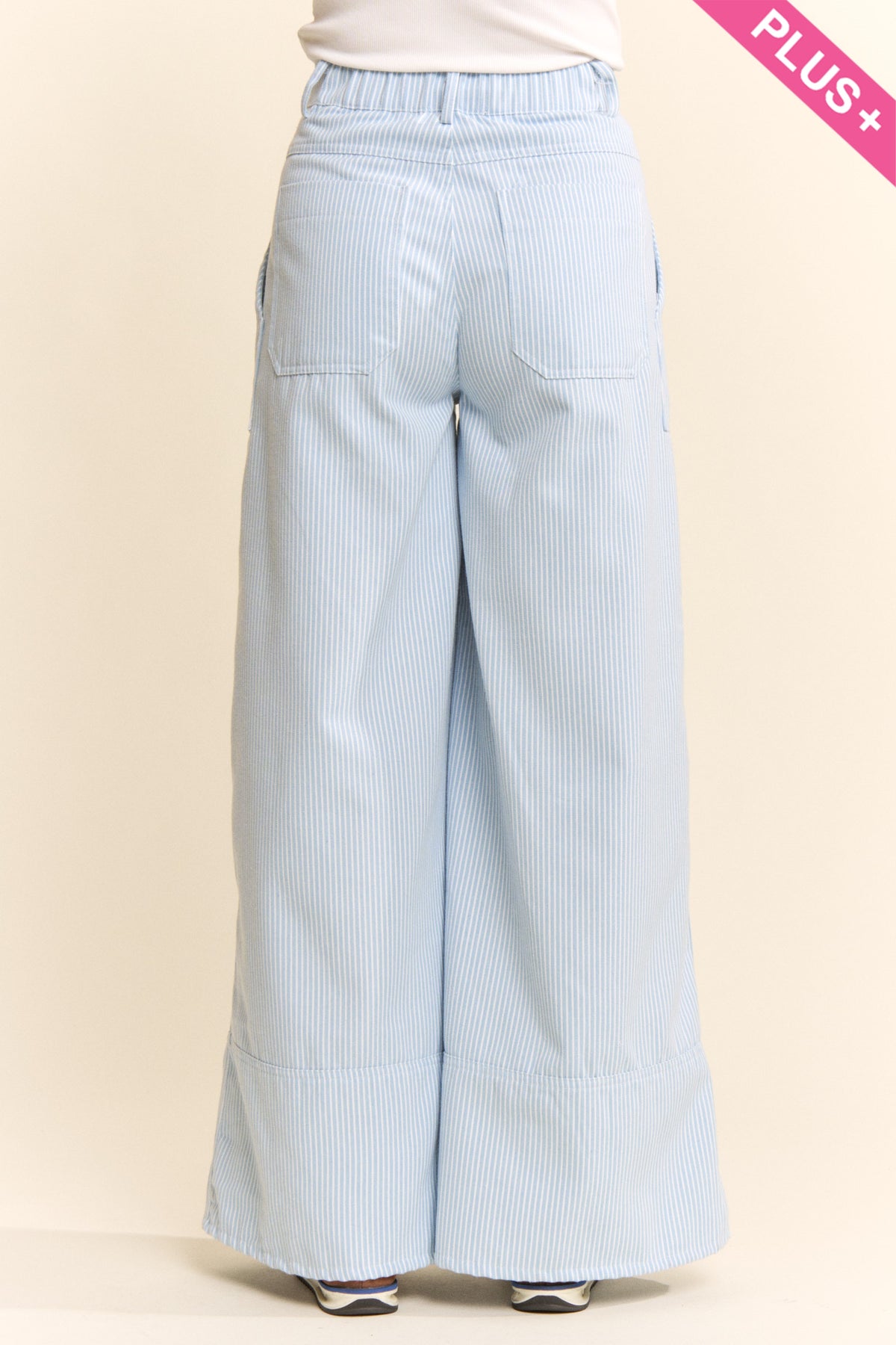 Back view of Davi & Dani blue pinstripe palazzo pants with patch pockets and wide leg silhouette