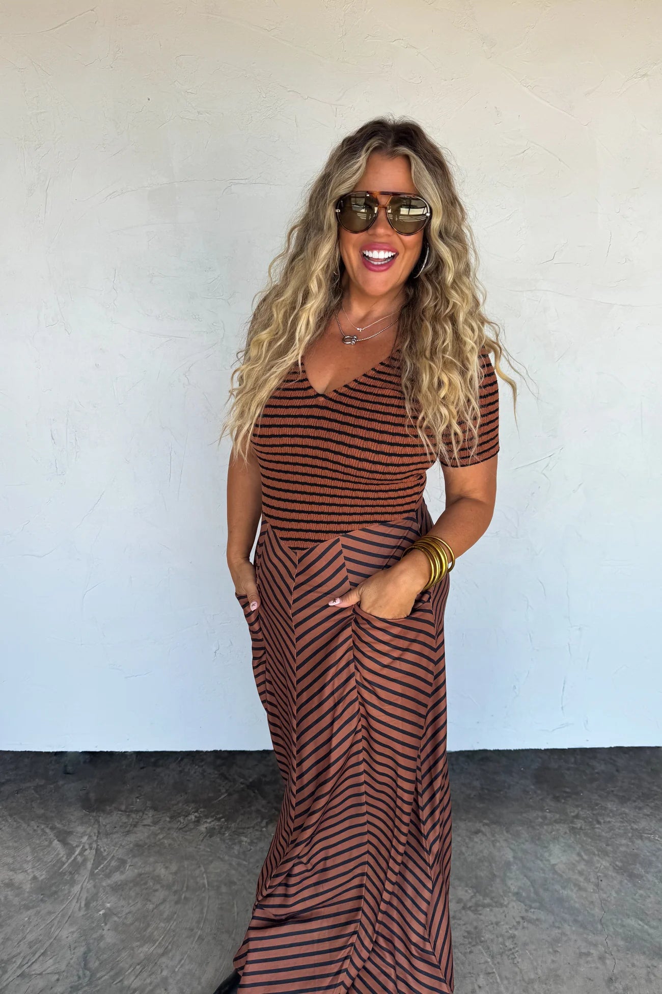 All-season dress with stretchy bodice and angled stripe skirt, versatile for everyday wear.
