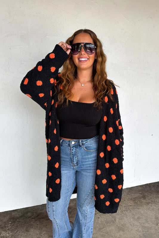 Boo Crew Reversible Cloud Cardigan by Blakeley in black with orange polka dots styled with denim
