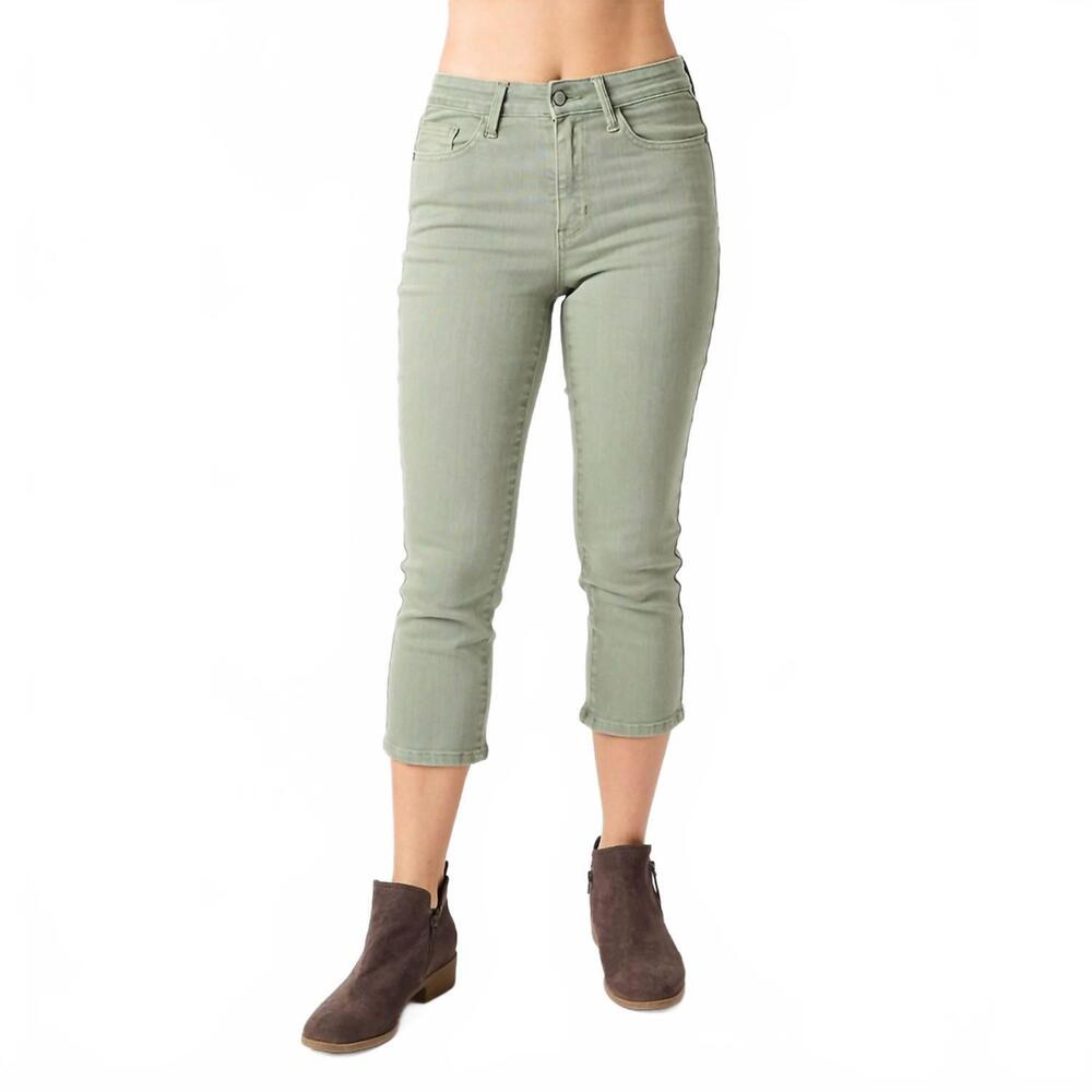 Woman wearing Sage Advice Capri by Judy Blue in soft sage green stretch denim featuring a mid-rise waist, slim capri fit, and functional pockets.
