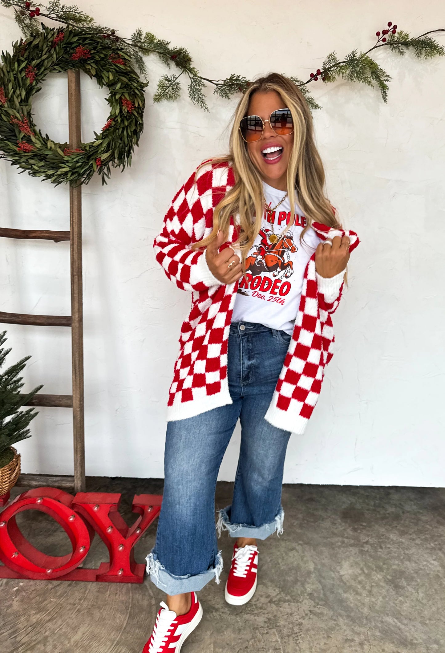 Ultra soft red and white checkered cloud cardigan by Blakeley worn with graphic tee and jeans
