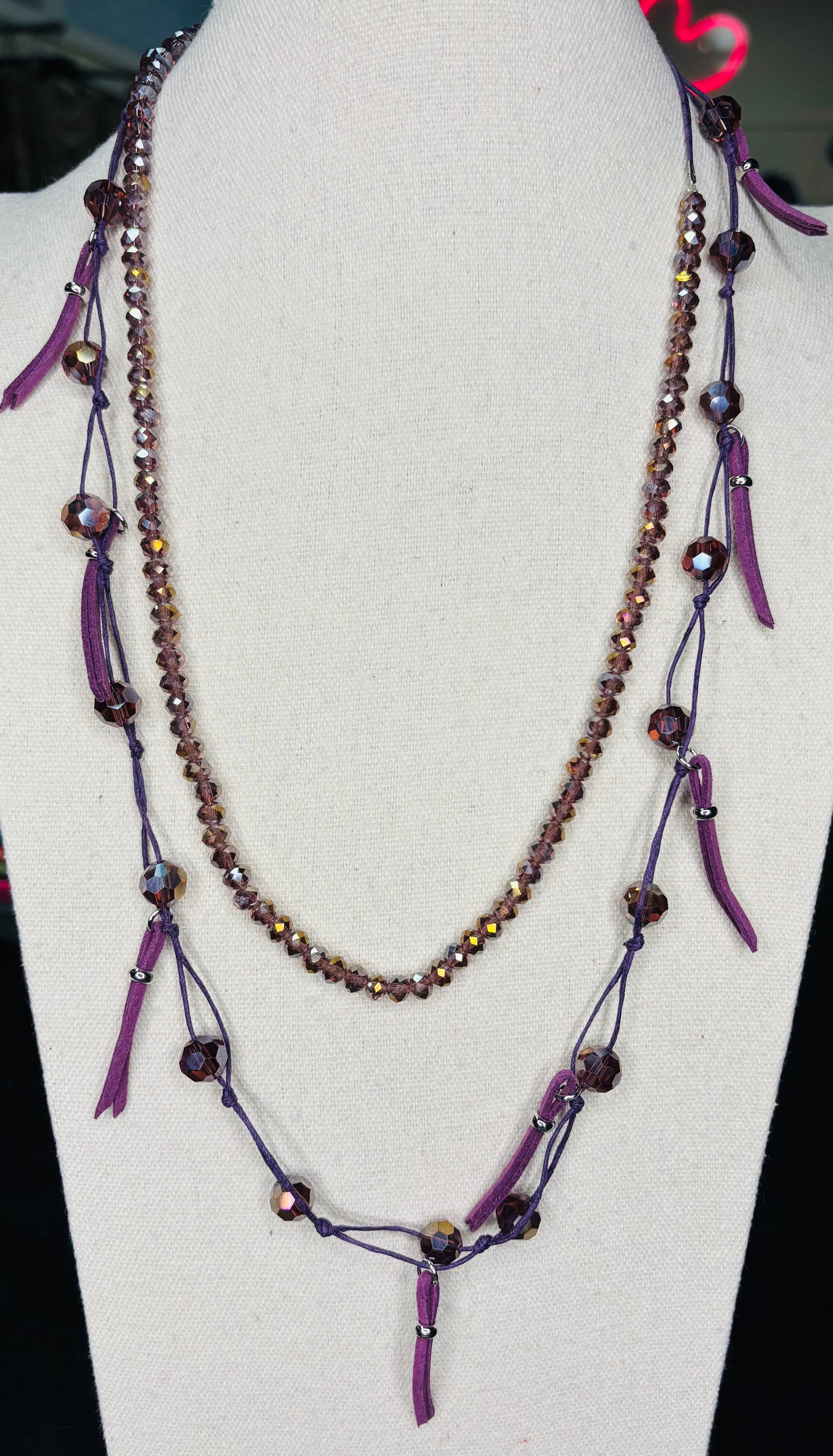 Beaded Necklace with leather on one side. Opposite side is stretchy. Great for layering,
