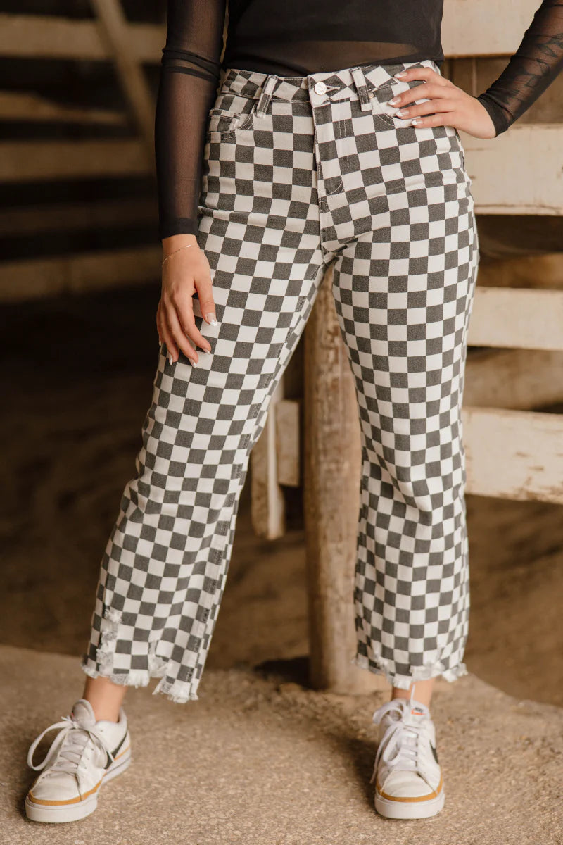 Fast Lane Pants by Sterling Kreek black and white checkered high rise distressed hem stretch jeans

Optional extra alt text versions:

Model wearing black and white checkered Fast Lane Pants by Sterling Kreek

Checkered high rise jeans with distressed raw hem detail

Sterling Kreek Fast Lane Pants statement denim boutique jeans