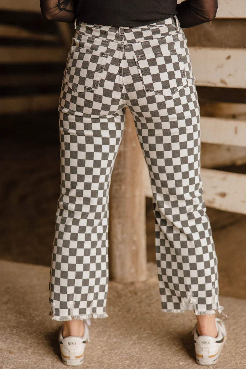 Fast Lane Pants by Sterling Kreek black and white checkered high rise distressed hem stretch jeans

Optional extra alt text versions:

Model wearing black and white checkered Fast Lane Pants by Sterling Kreek

Checkered high rise jeans with distressed raw hem detail

Sterling Kreek Fast Lane Pants statement denim boutique jeans