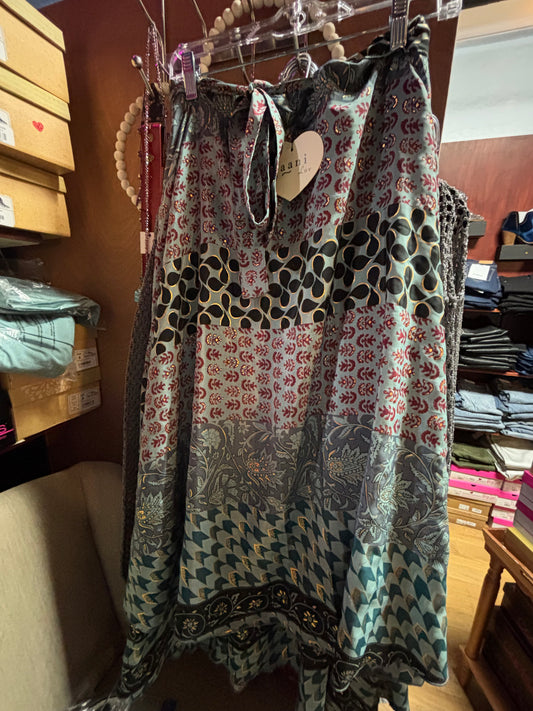 Teal wrap skirt with mixed patterns in gold, burgundy, and black featuring a silky drape and adjustable tie waist by Paani Luv