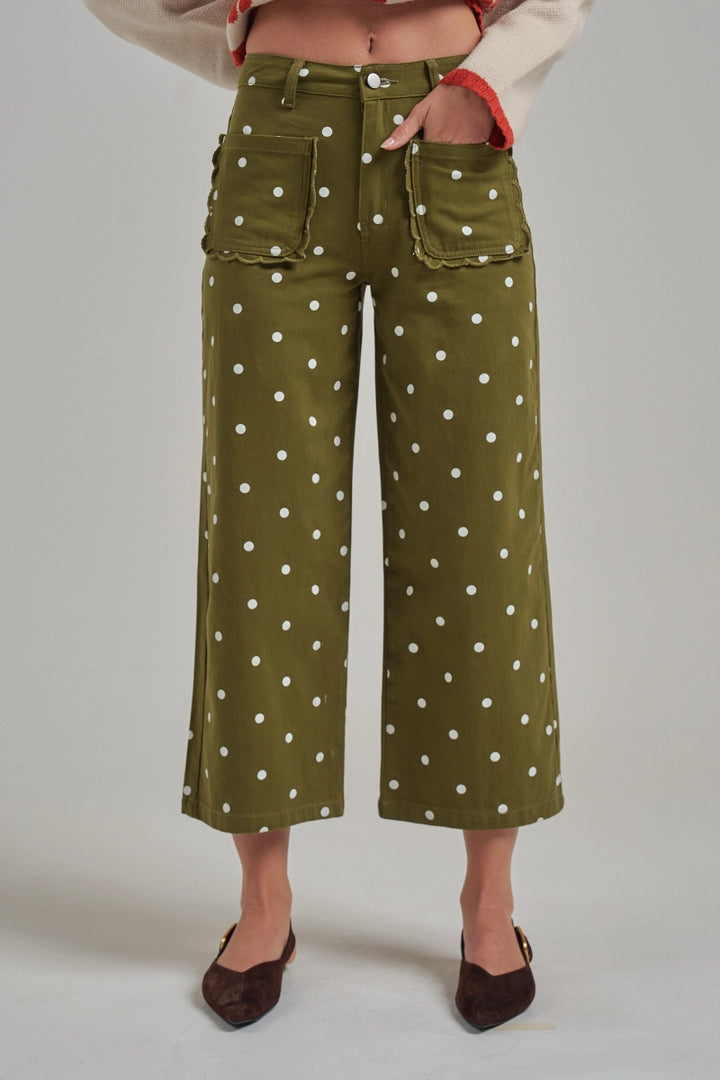 Olive green polka dot cropped wide leg pants with scalloped front patch pockets.