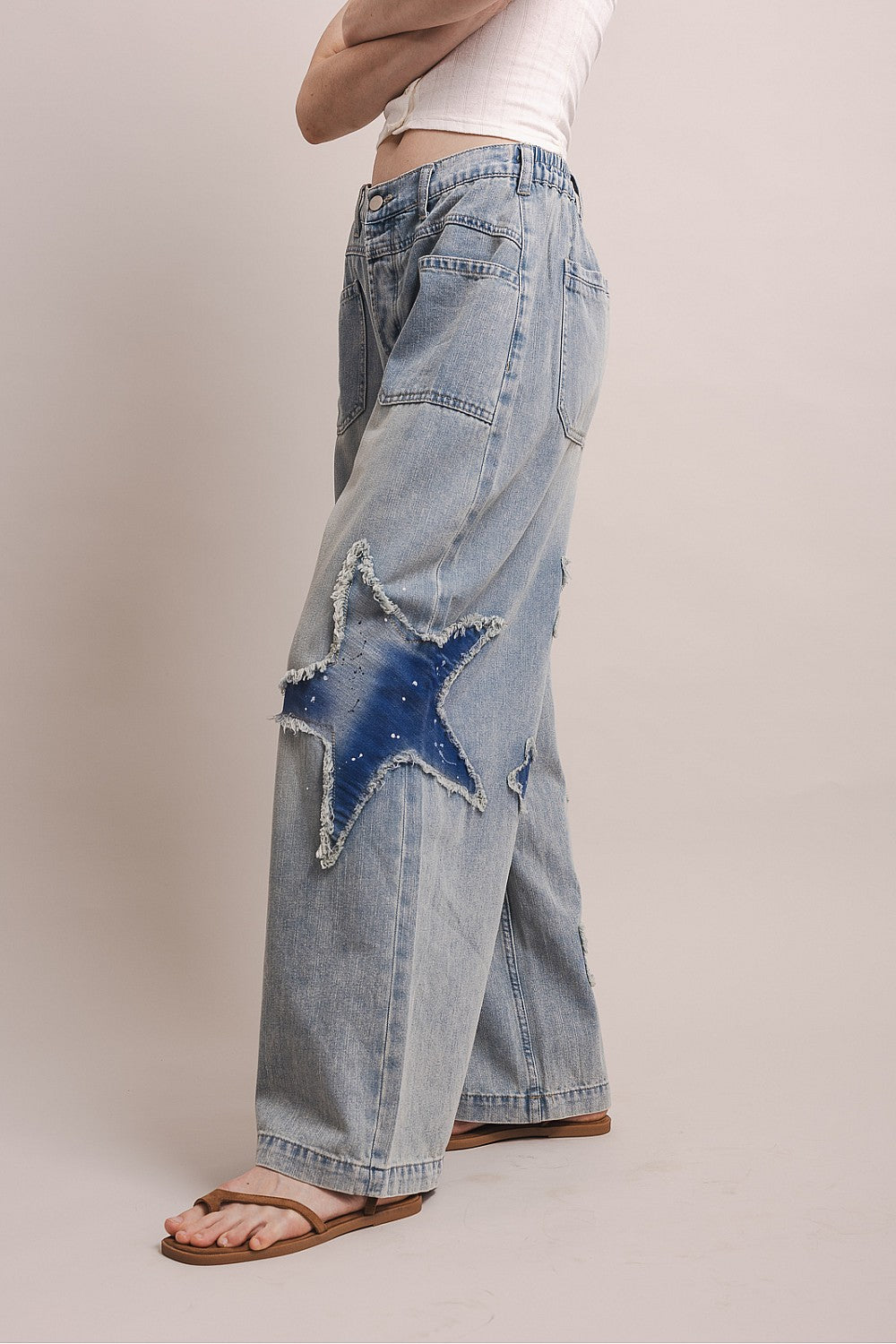 Wide leg denim pants with distressed star patches and elastic back waistband in a relaxed fit by BlueVelvet