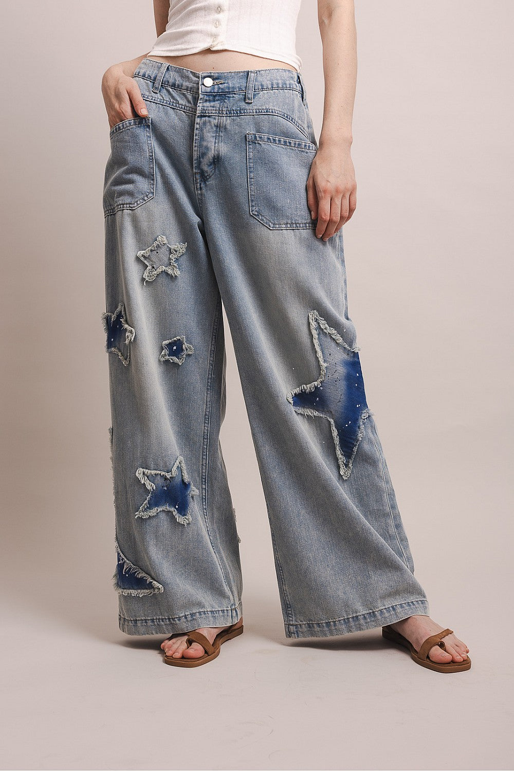 Wide leg denim pants with distressed star patches and elastic back waistband in a relaxed fit by BlueVelvet