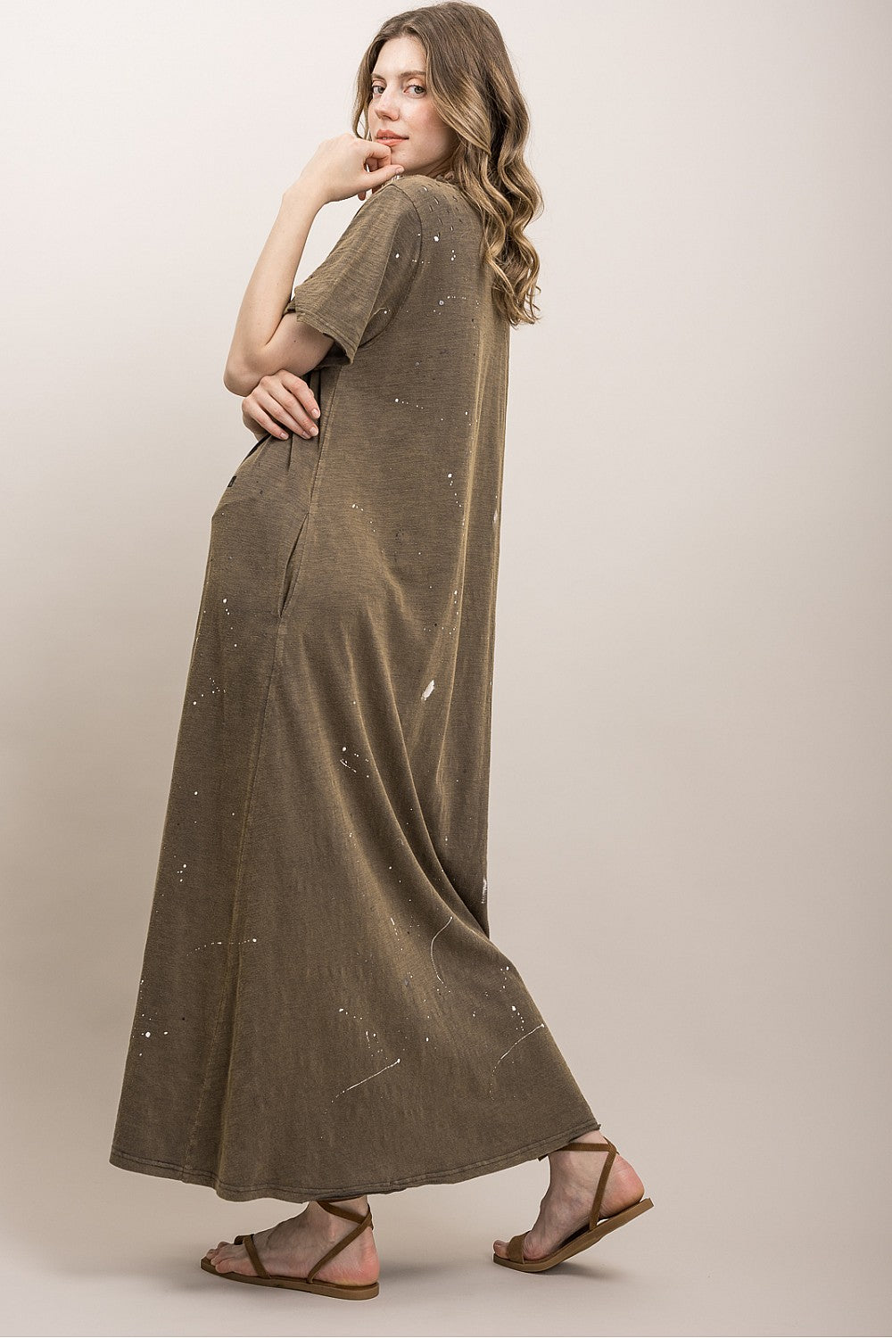 Back view of the Dirty Hippie Graphic Maxi Dress by Blue Velvet highlighting distressed shoulder details, relaxed oversized fit, and lightweight 100% cotton fabric.