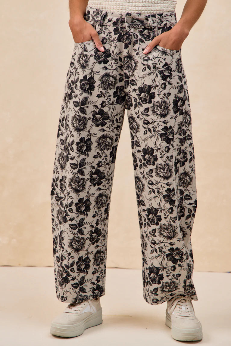 Grey twill barrel pants with black rose floral print and relaxed fit by BiBi