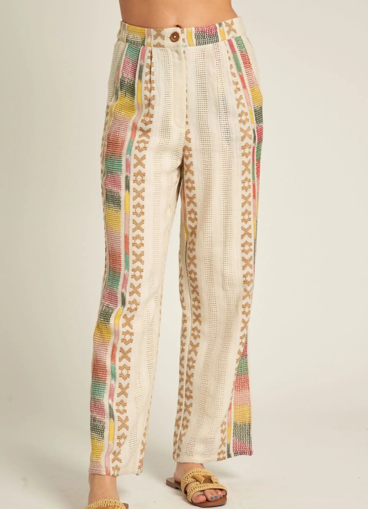 Close-up of the Beach Days Set by En Crème showcasing embroidered wide-leg pants with side pockets, button closure, elastic back waist, and cotton lining.