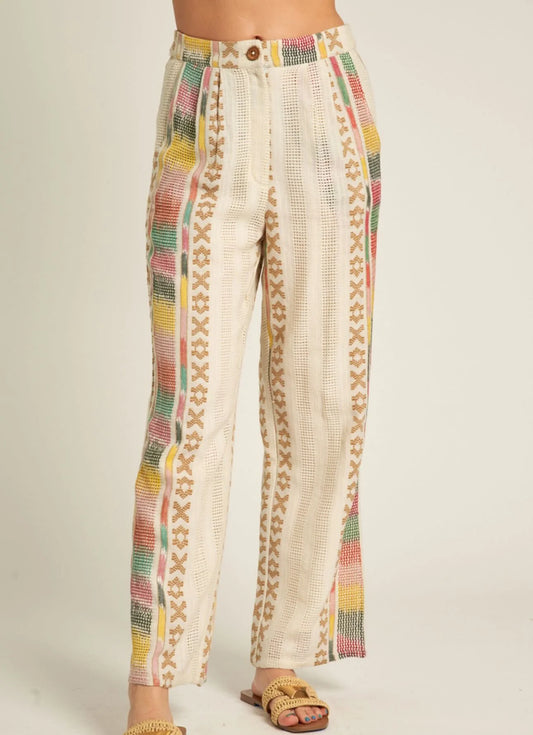 Close-up of the Beach Days Set by En Crème showcasing embroidered wide-leg pants with side pockets, button closure, elastic back waist, and cotton lining.