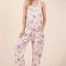 Petal & Promise Eyelet Jumpsuit by Gee Gee featuring floral eyelet embroidery, adjustable straps, roomy boho fit, and front pockets.