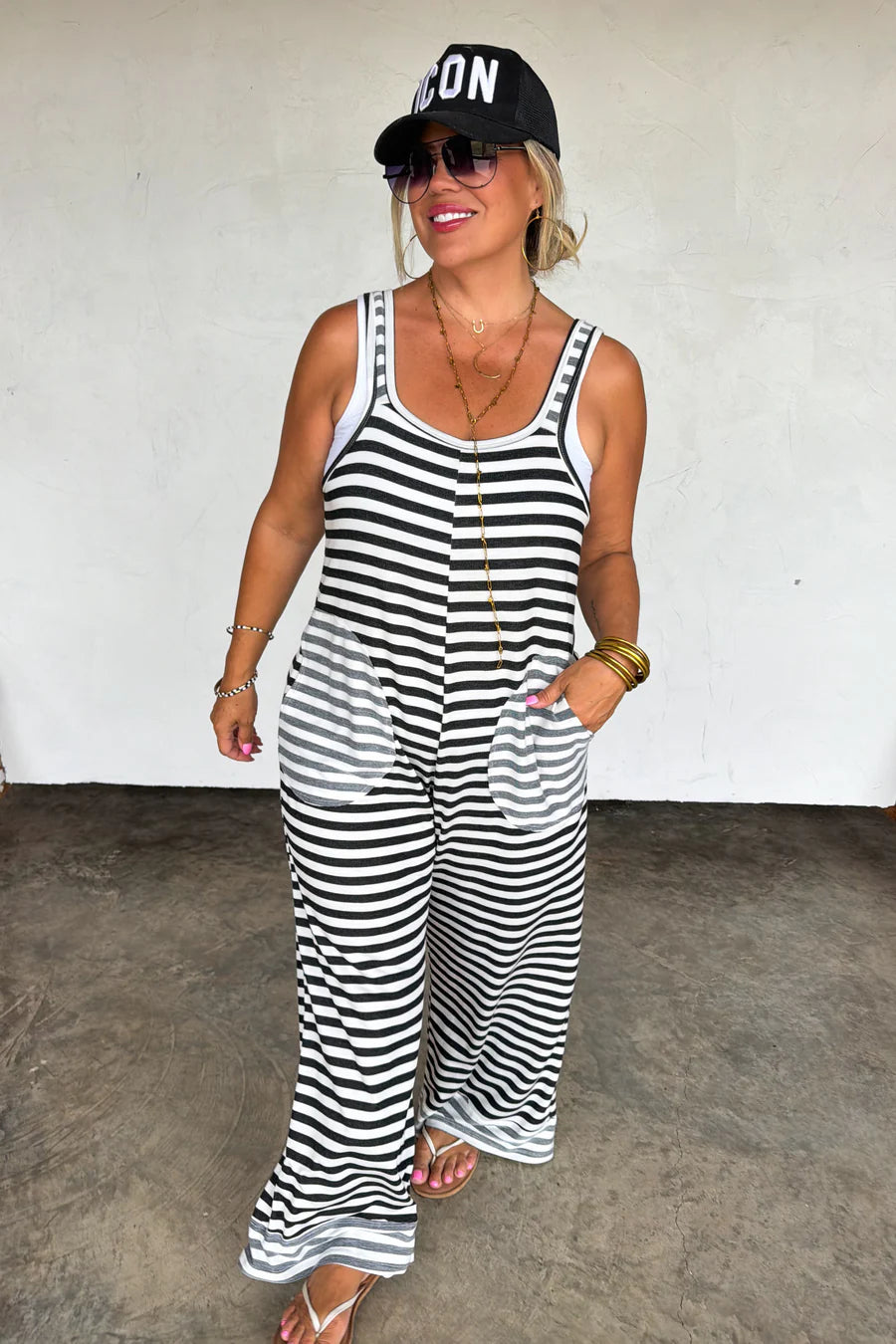 Ricki Stripe Terry Romper by Blakeley featuring black and ivory stripes, ultra-soft baby terry fabric, oversized side pockets, sleeveless wide-leg silhouette, and relaxed stretch fit.