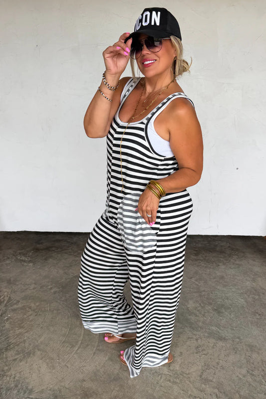 Ricki Stripe Terry Romper by Blakeley featuring black and ivory stripes, ultra-soft baby terry fabric, oversized side pockets, sleeveless wide-leg silhouette, and relaxed stretch fit.