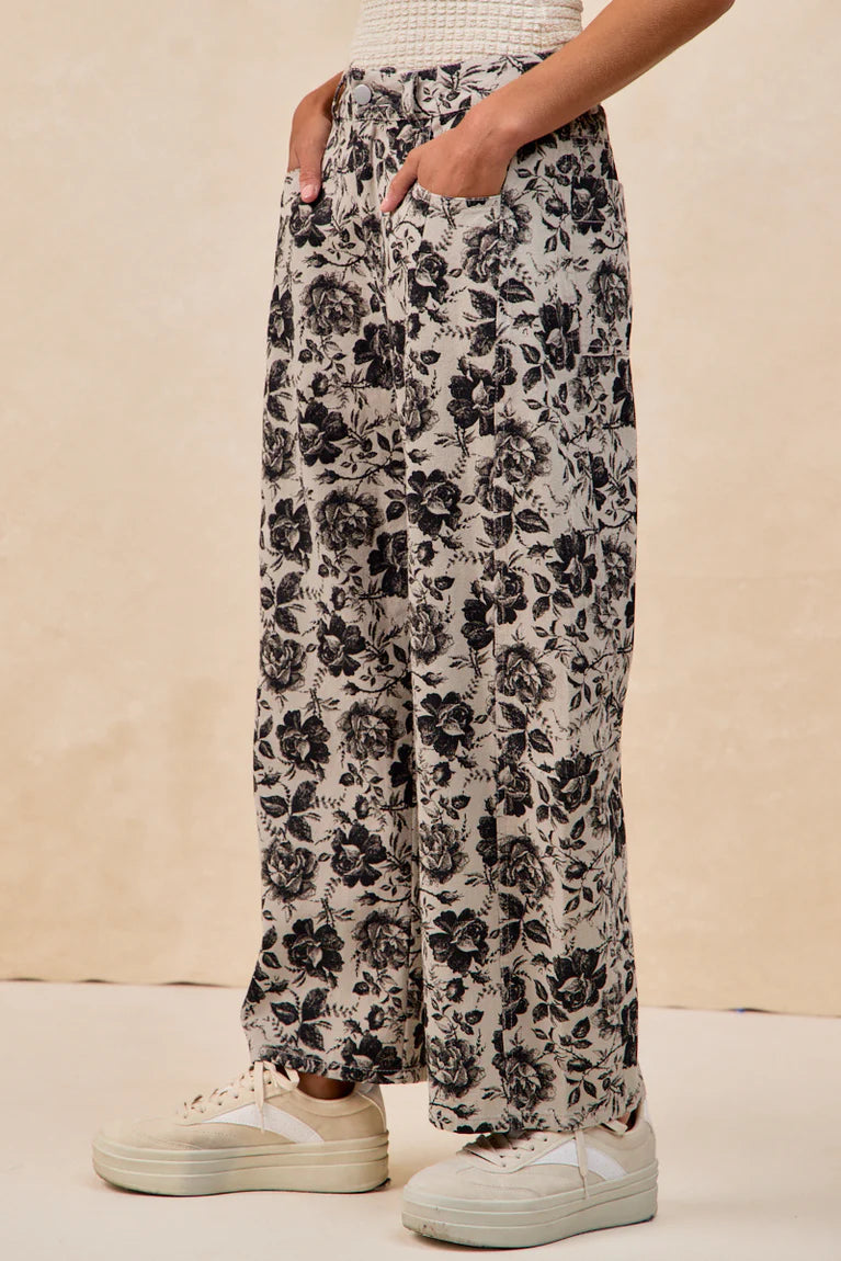 Grey twill barrel pants with black rose floral print and relaxed fit by BiBi
