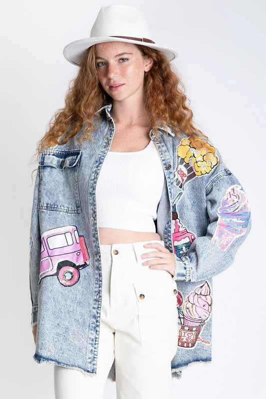Making Memories Denim Shacket by BlueVelvet featuring whimsical sequin patches, oversized fit, front pockets, raw edge hem, rolled sleeves, and playful dog graphic on the back.